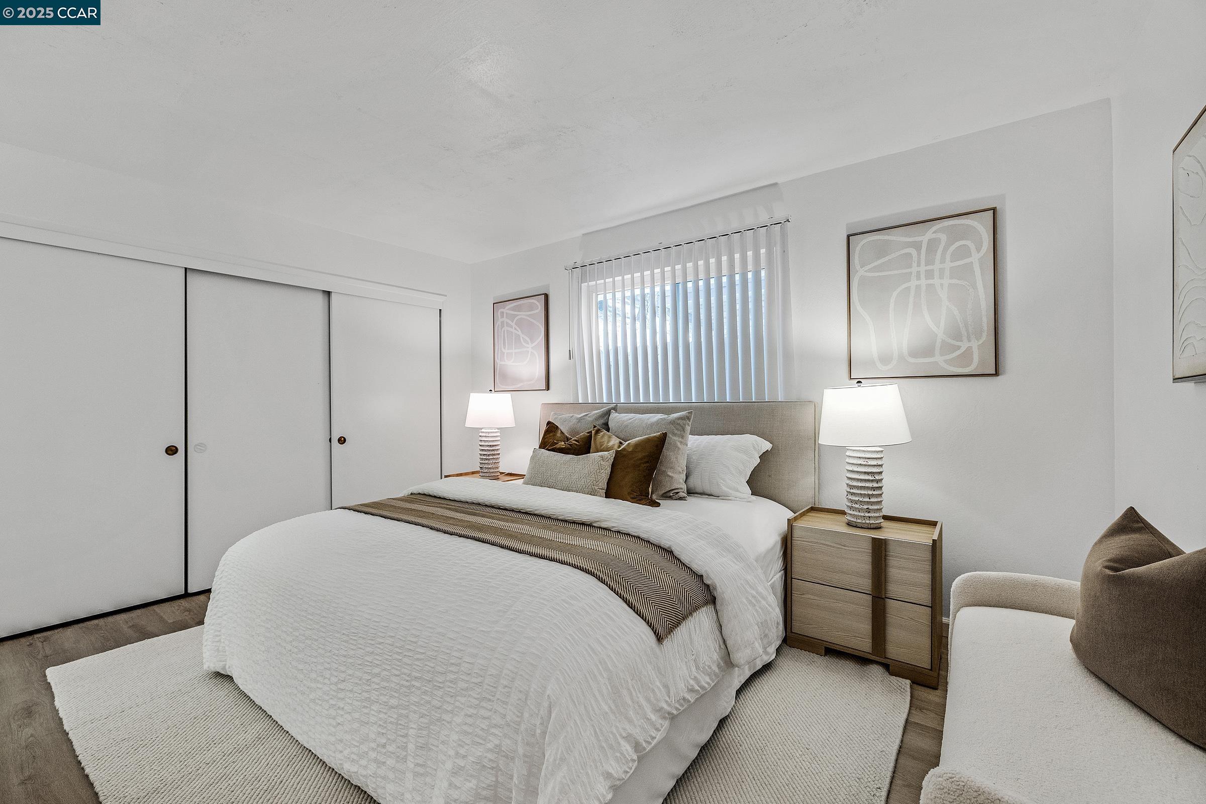 146 Ascot Court, Unit 2 Moraga, CA 94556 - Photo 18 of 33 a large white bed in a white room