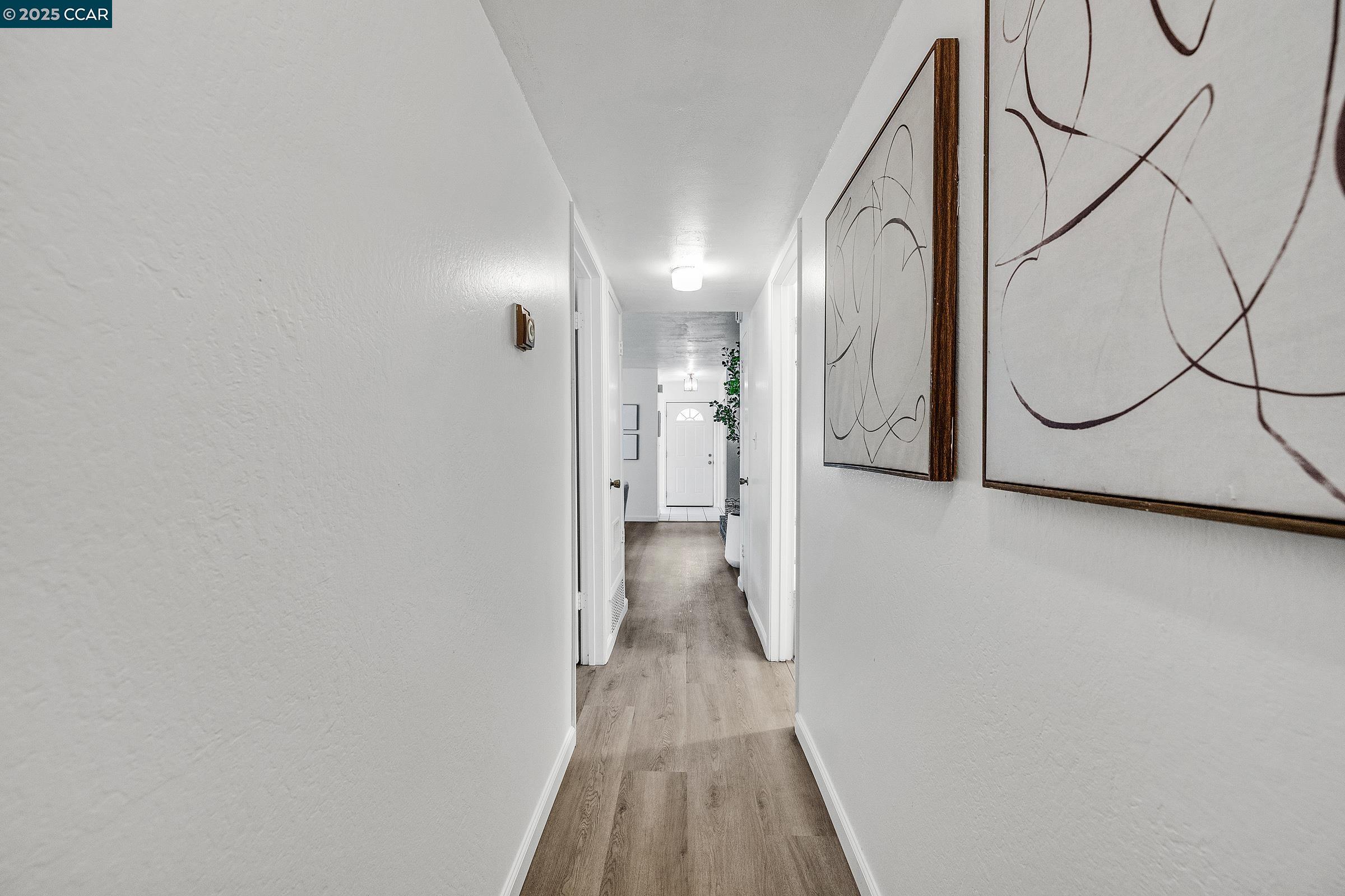 146 Ascot Court, Unit 2 Moraga, CA 94556 - Photo 21 of 33 a view of hallway with wooden floor