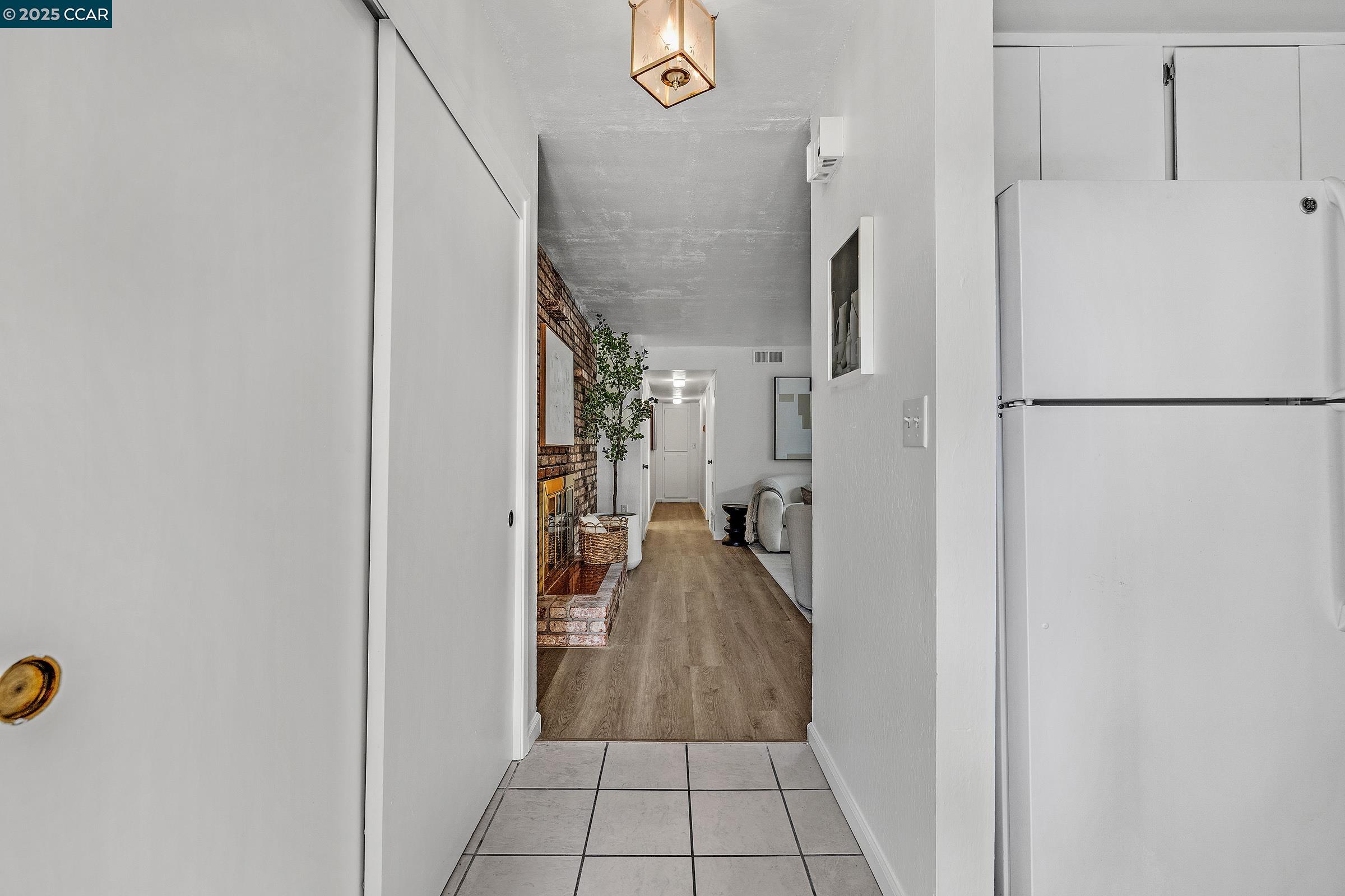 146 Ascot Court, Unit 2 Moraga, CA 94556 - Photo 22 of 33 a view of a kitchen with a refrigerator
