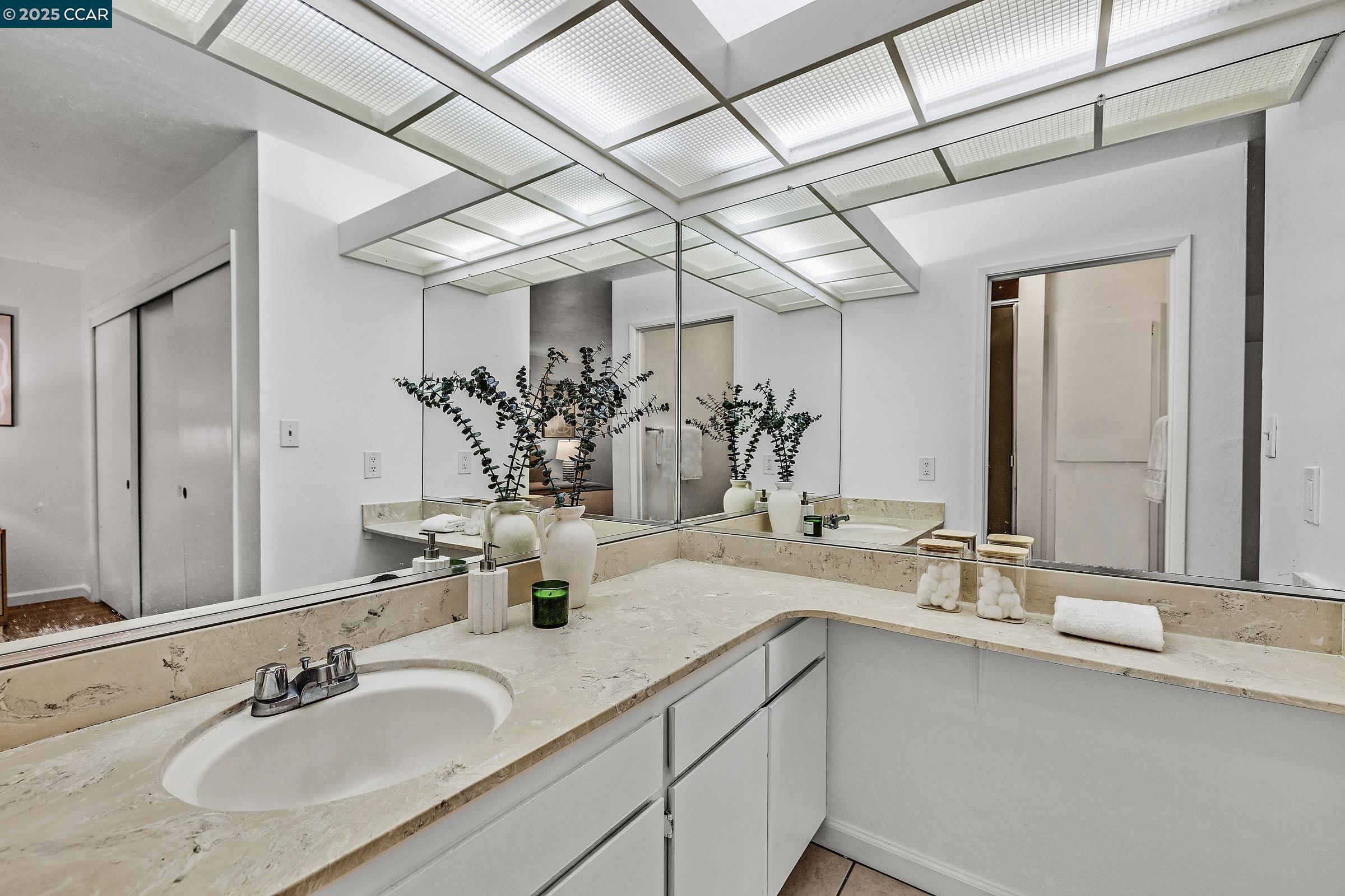 146 Ascot Court, Unit 2 Moraga, CA 94556 - Photo 26 of 33 a bathroom with double vanity sinks and a mirror