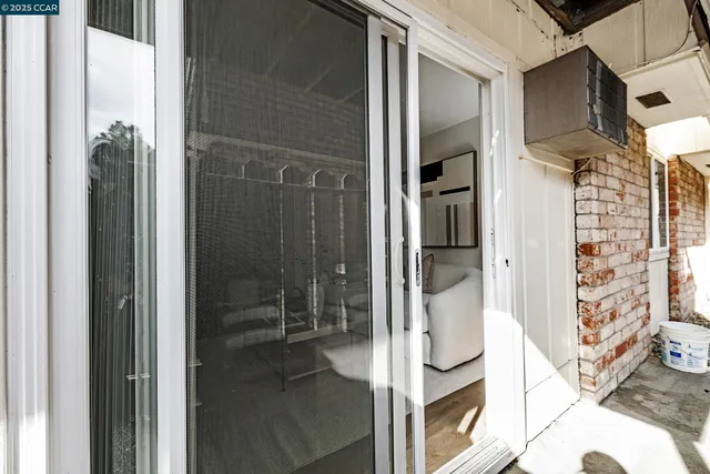 a view of an entryway with wooden floor and stairs