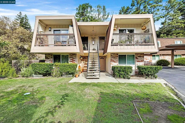 a view of a building with a yard