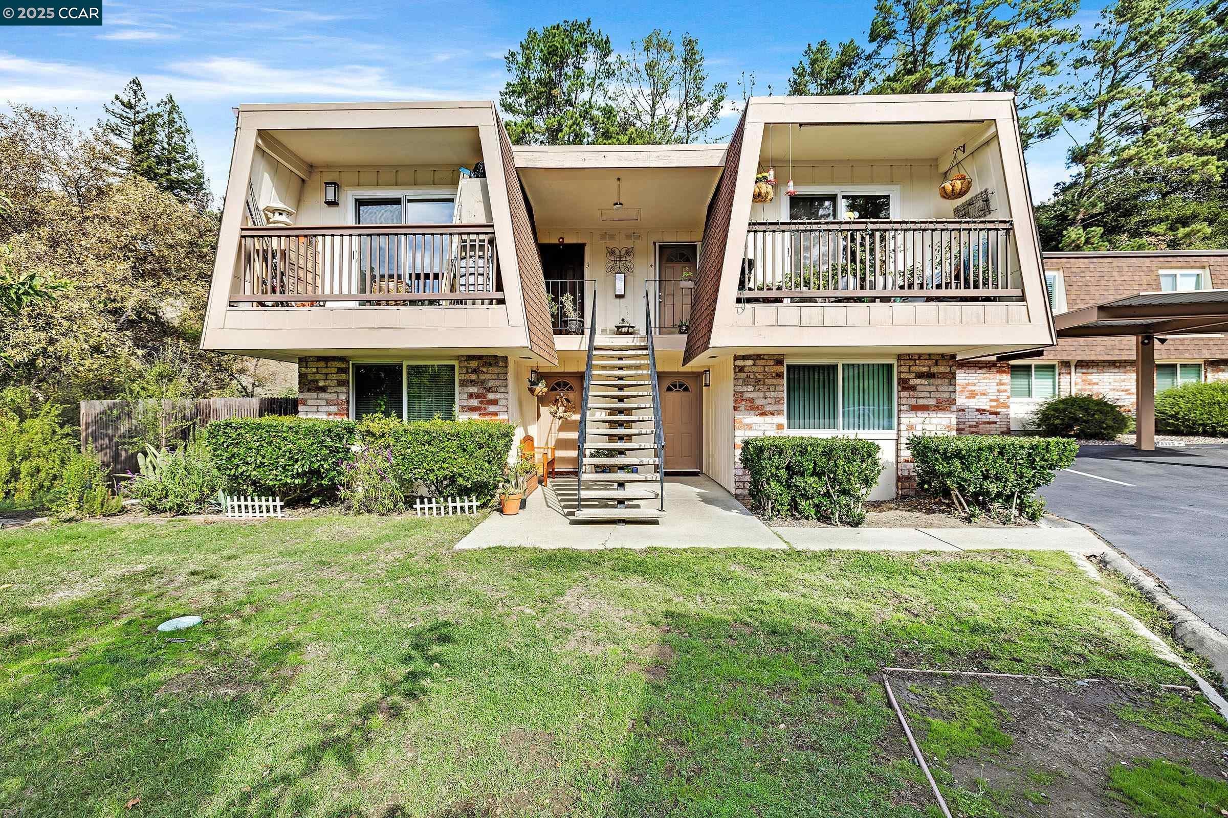 146 Ascot Court, Unit 2 Moraga, CA 94556 - Photo 3 of 33 a view of a building with a yard