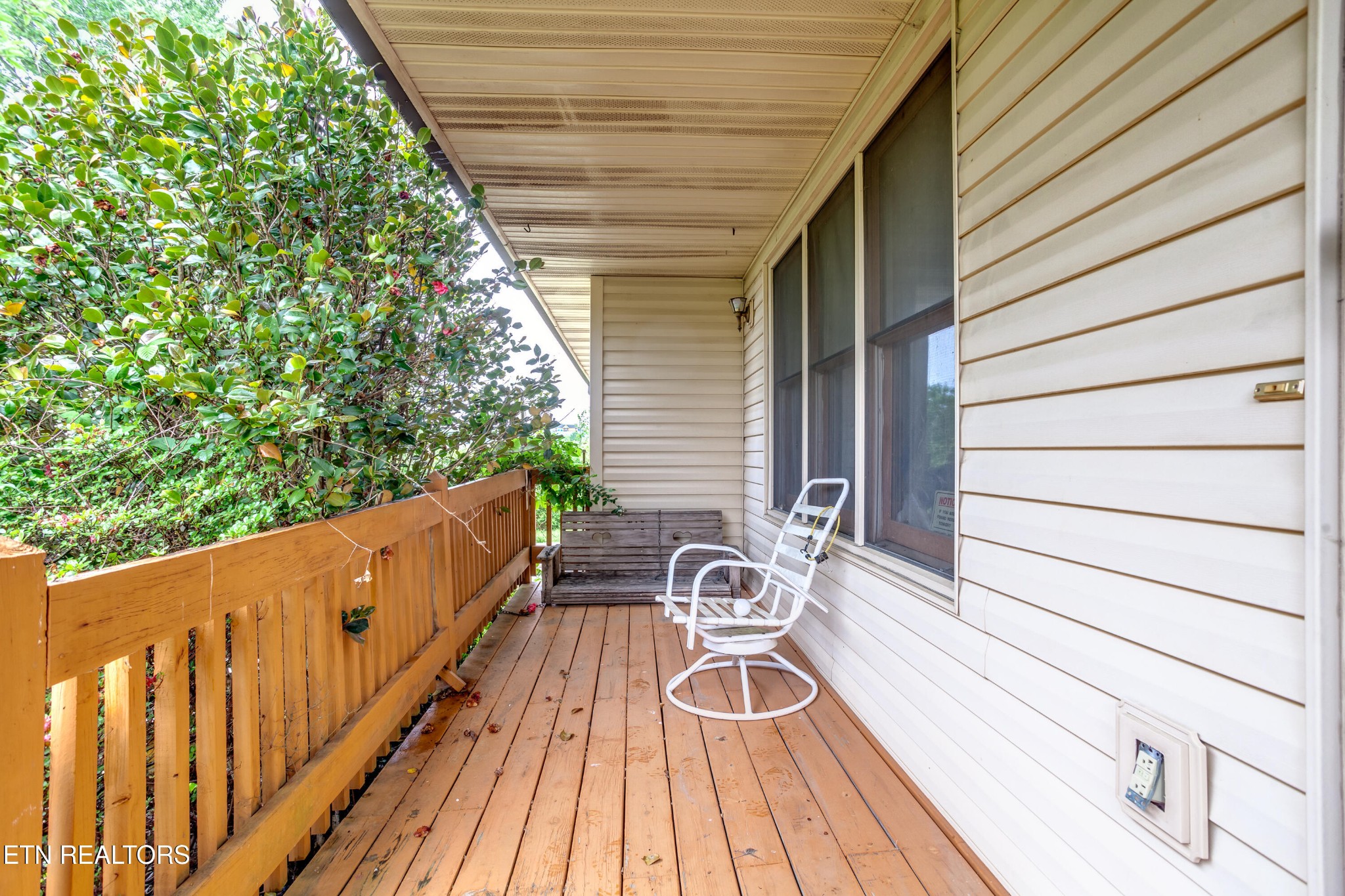 375 Rainbow Road Sevierville, TN 37862 - Photo 11 of 58 a view of balcony with wooden floor and fence and a potted plant
