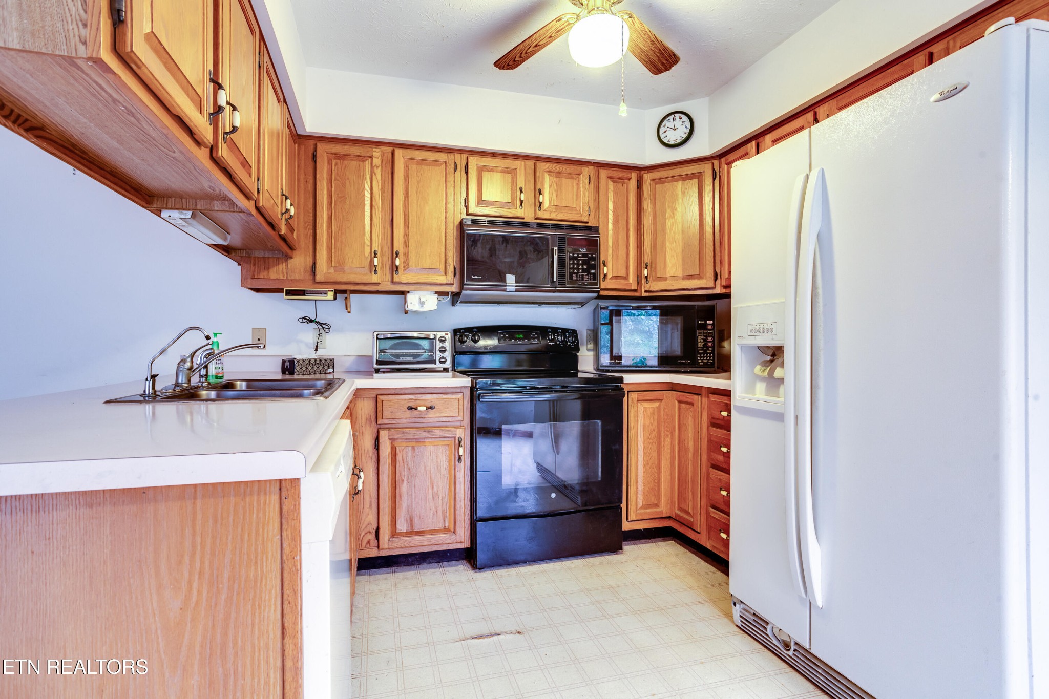 375 Rainbow Road Sevierville, TN 37862 - Photo 19 of 58 a kitchen with stainless steel appliances granite countertop a refrigerator a stove top oven a sink and dishwasher