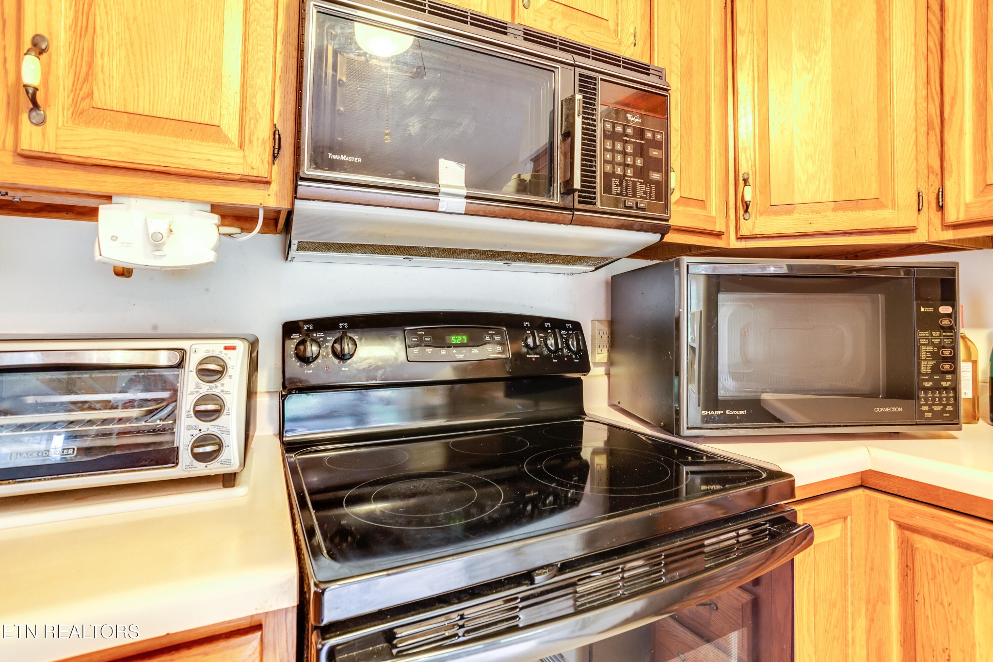 375 Rainbow Road Sevierville, TN 37862 - Photo 21 of 58 a kitchen with a stove and a microwave