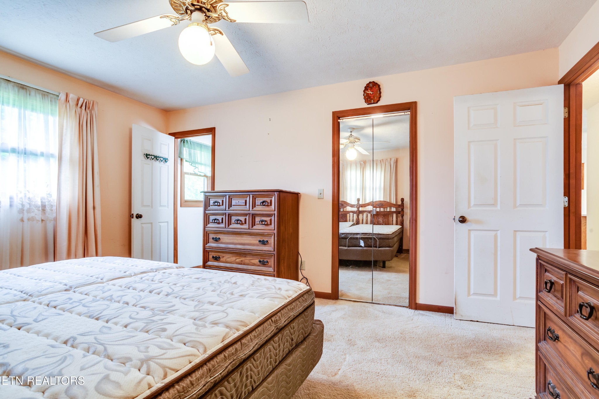 375 Rainbow Road Sevierville, TN 37862 - Photo 29 of 58 a bedroom with a bed and a large mirror