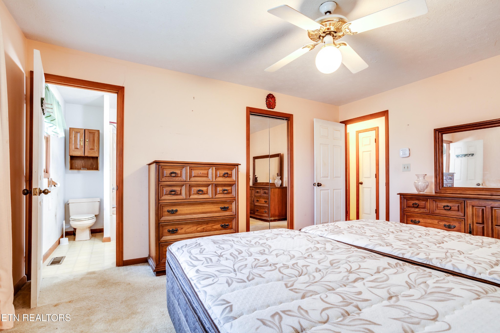 375 Rainbow Road Sevierville, TN 37862 - Photo 31 of 58 a bedroom with a large bed a chandelier and dresser