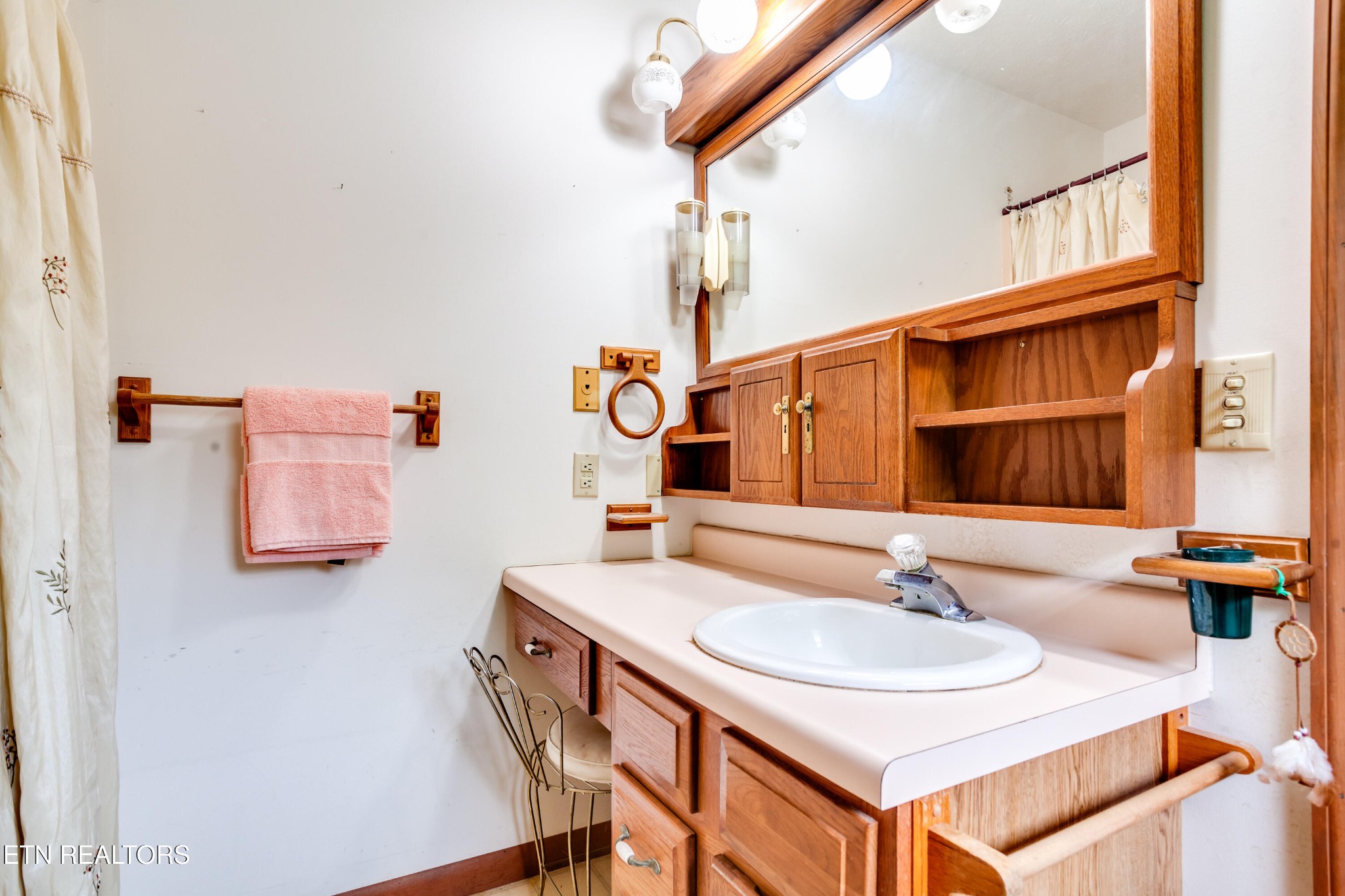 375 Rainbow Road Sevierville, TN 37862 - Photo 33 of 58 a bathroom with a sink and a mirror