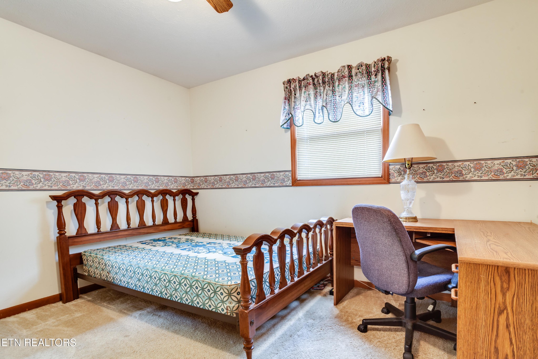 375 Rainbow Road Sevierville, TN 37862 - Photo 34 of 58 a bedroom with a bed and chair