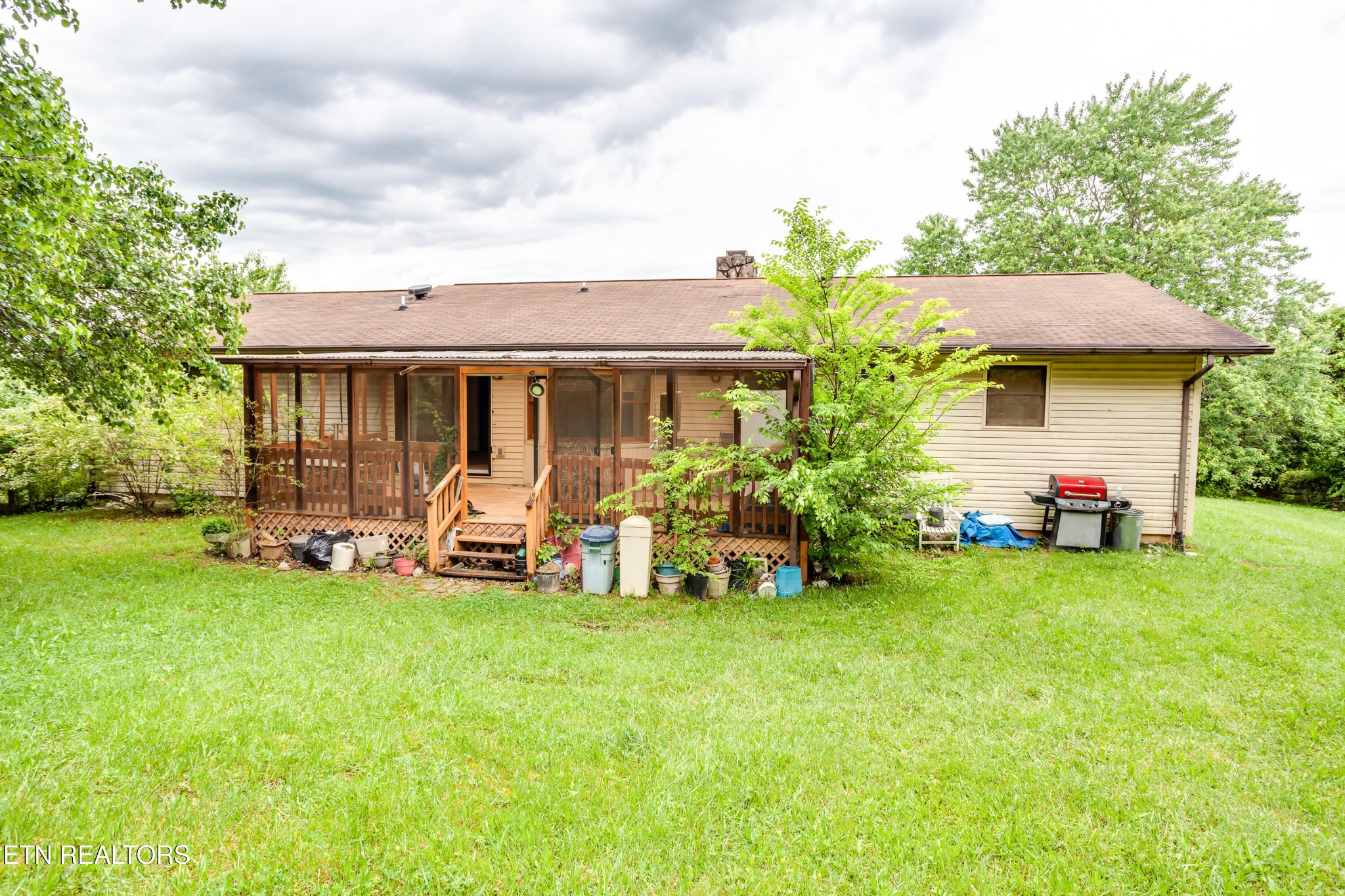 375 Rainbow Road Sevierville, TN 37862 - Photo 41 of 58 a view of a house with backyard porch and sitting area