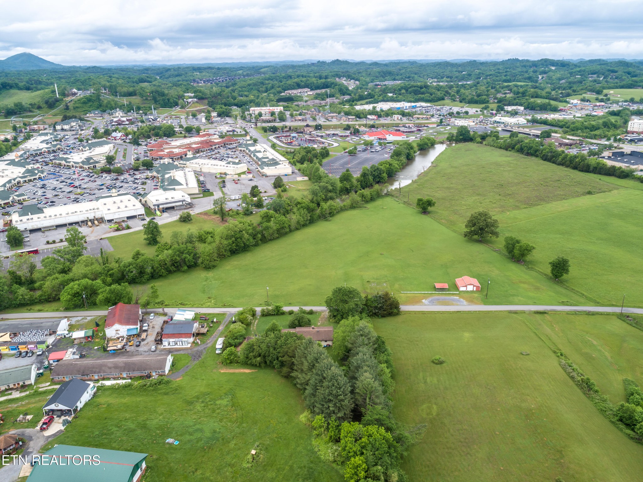 375 Rainbow Road Sevierville, TN 37862 - Photo 56 of 58 an aerial view of a city with lots of residential buildings and mountain view in back