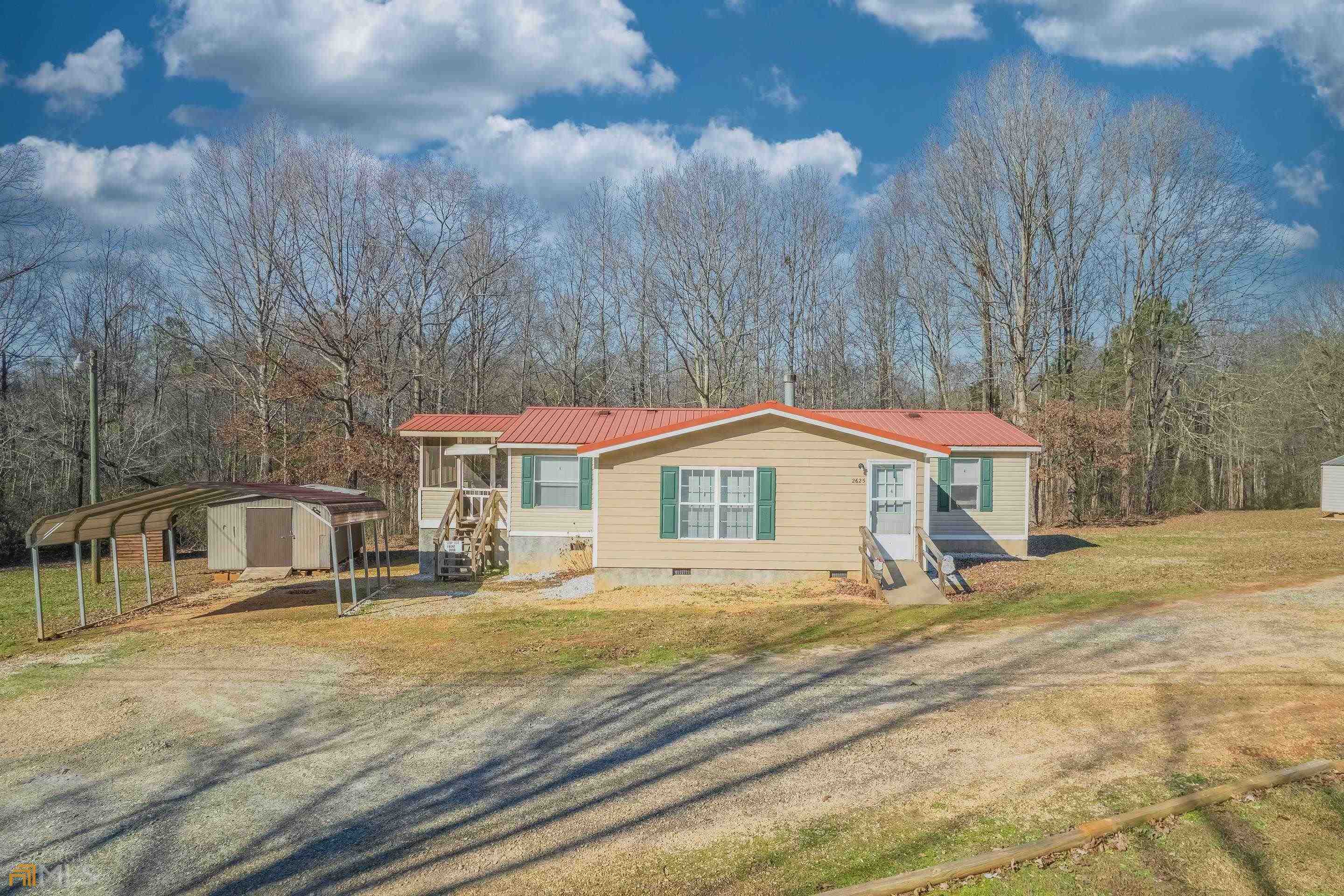 2625 Cole Road Carnesville, GA 30521 - Photo 1 of 1 a front view of a house with a yard