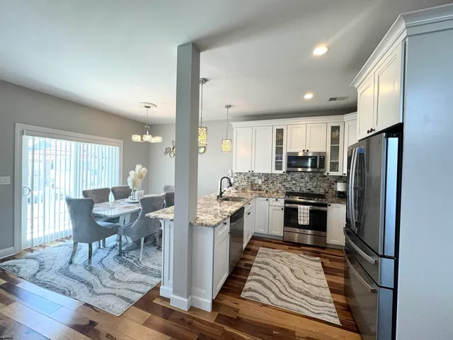 a bathroom with a shower and a sink