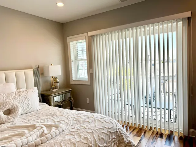 a bathroom with a shower and a sink a mirror