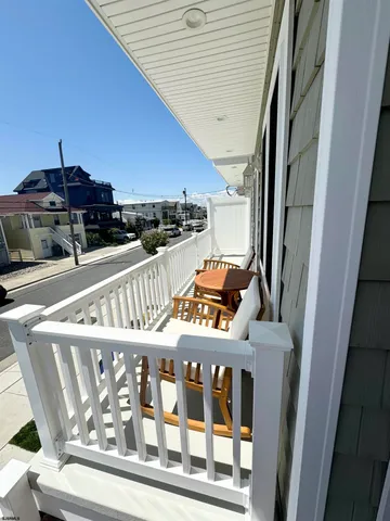 a view of a patio with a table and chairs
