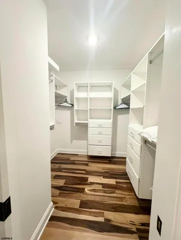 a bathroom with a sink vanity and a mirror