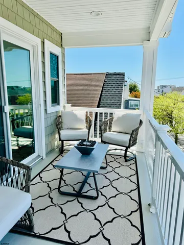 a bedroom with a bed and a large mirror