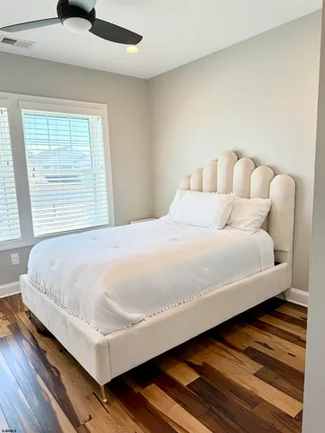 a view of an empty room and wooden floor