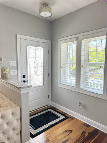 a living room with furniture fireplace and flat screen tv
