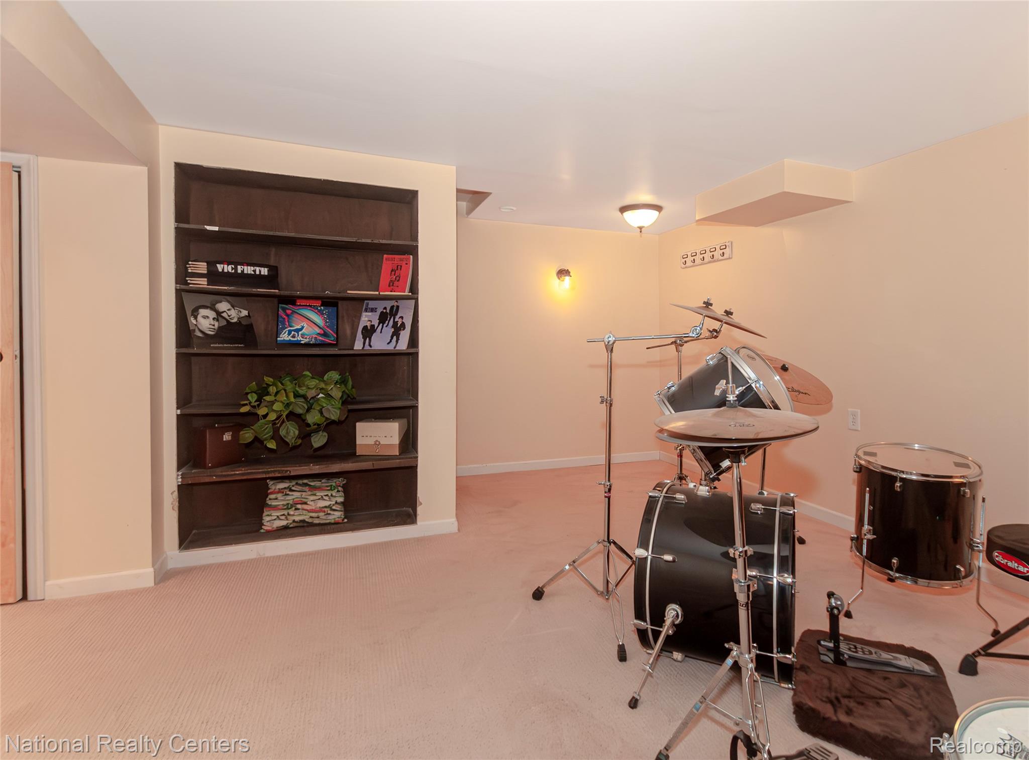 2446 Milverton Road Troy, MI 48083 - Photo 29 of 41 Recreation room with light carpet and baseboards