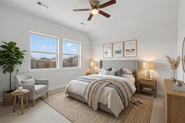 a bedroom with a large bed and a window