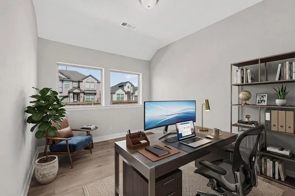 a view of a workspace with furniture