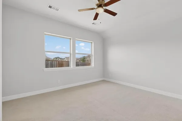 a large kitchen with stainless steel appliances kitchen island a large counter top and a stove top oven