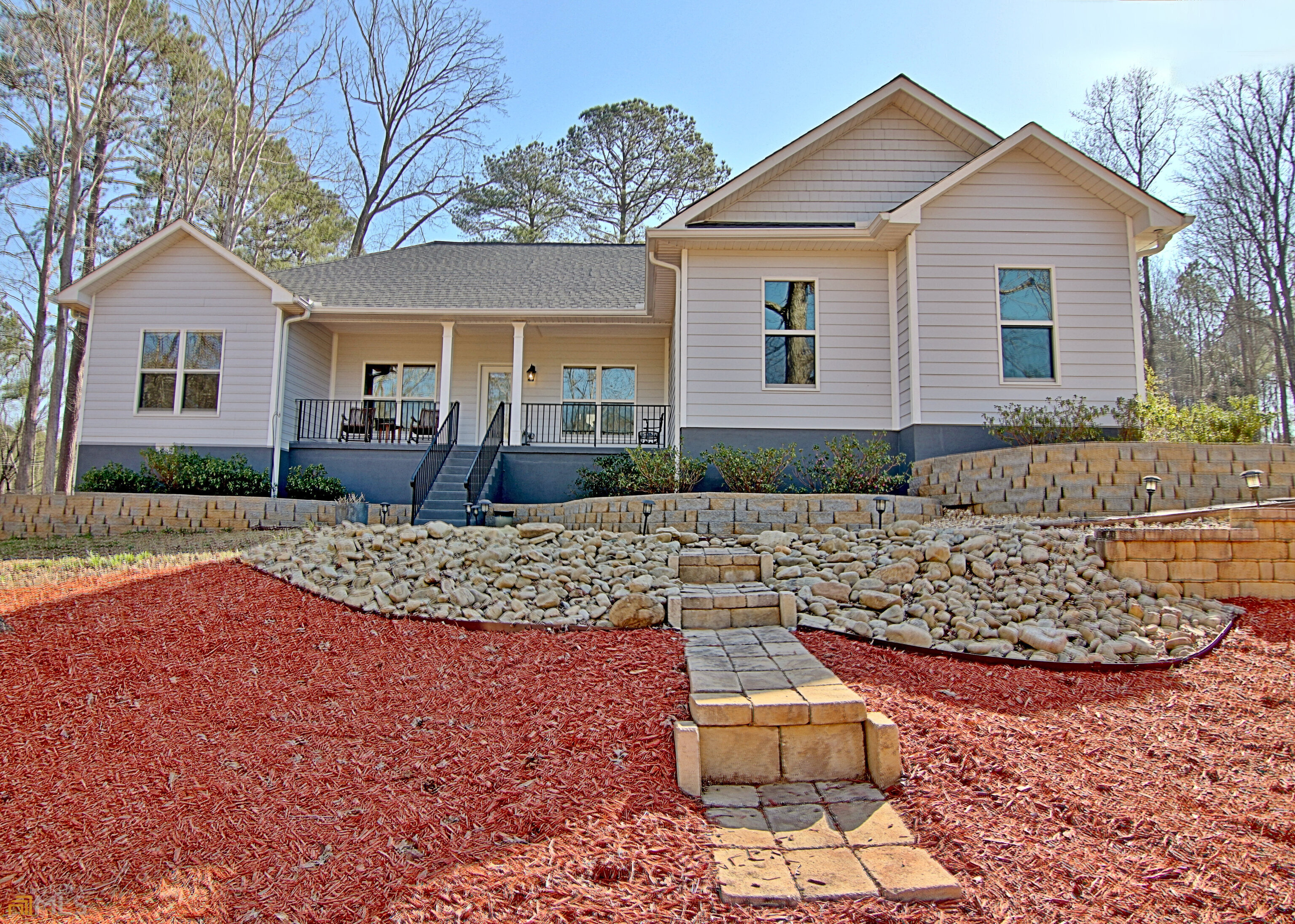 93 Walt Carmichael Road Newnan, GA 30263 - Photo 1 of 1 a front view of a house with a yard and garage