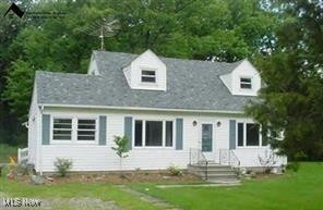 7117 Risden Road Vermilion, OH 44089 - Photo 1 of 1 Cape cod-style house featuring a front yard