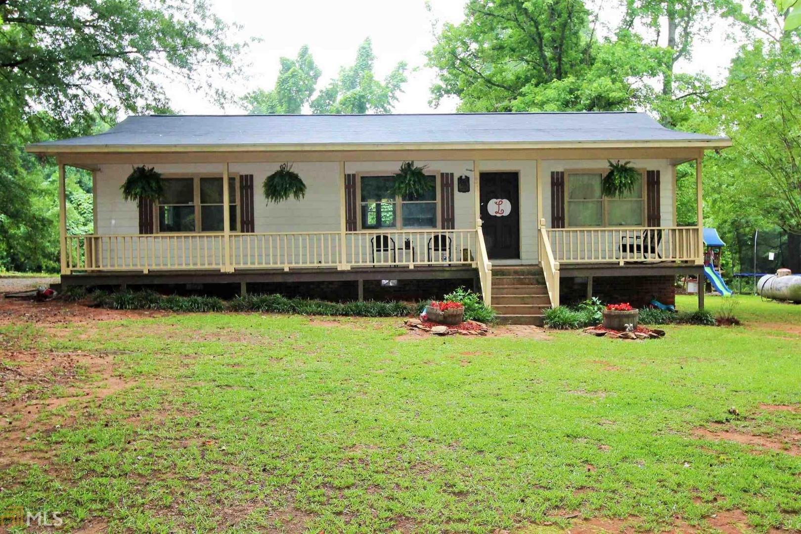 61 Deer Run Road Newborn, GA 30056 - Photo 1 of 1 a view of a house with a backyard
