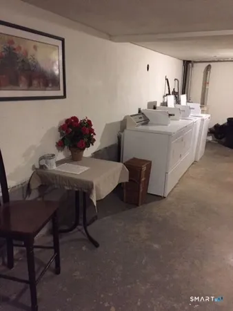 a view of a workspace with furniture