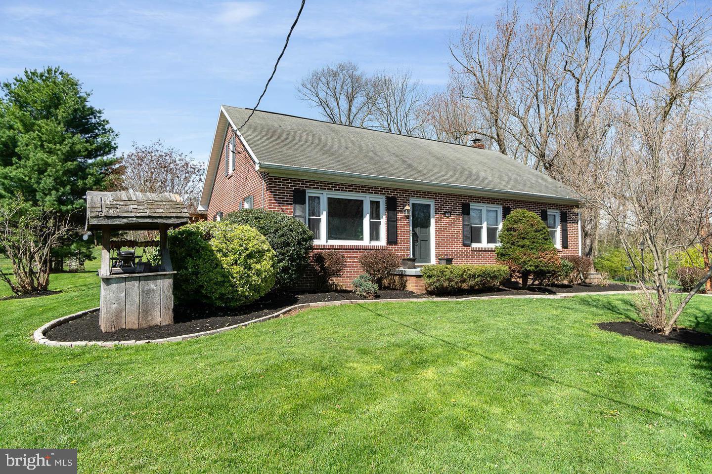 857 White Hall Road Littlestown, PA 17340 - Photo 1 of 32 a front view of house with a garden
