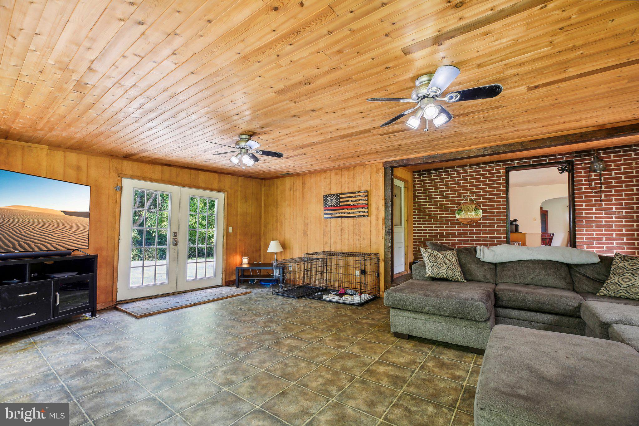 857 White Hall Road Littlestown, PA 17340 - Photo 11 of 32 a living room with furniture and a flat screen tv