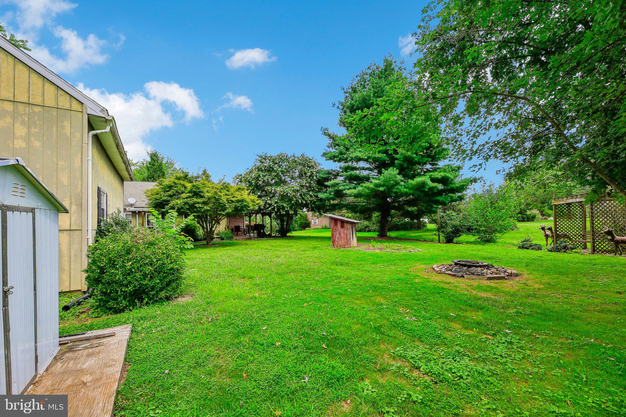 857 White Hall Road Littlestown, PA 17340 - Photo 14 of 32 a white and green field with lots of bushes