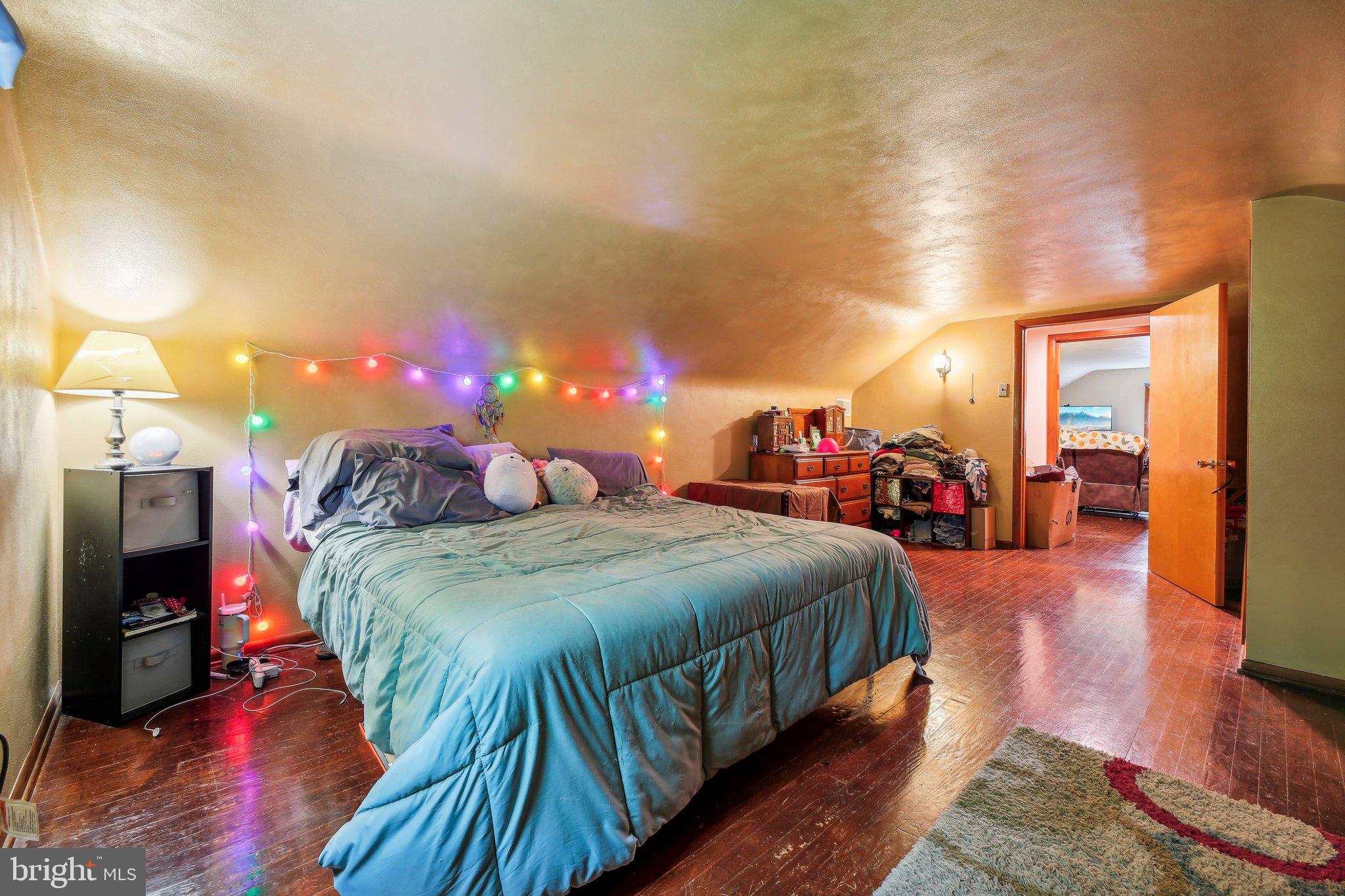 857 White Hall Road Littlestown, PA 17340 - Photo 21 of 32 a bed room with a bed and a chandelier