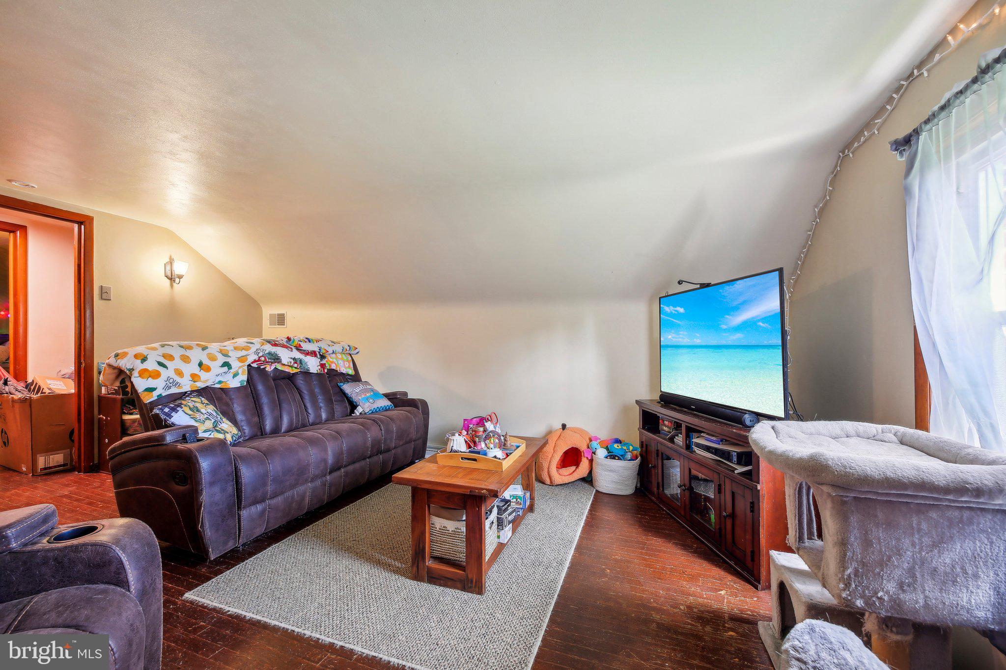 857 White Hall Road Littlestown, PA 17340 - Photo 23 of 32 a living room with furniture workspace and a flat screen tv