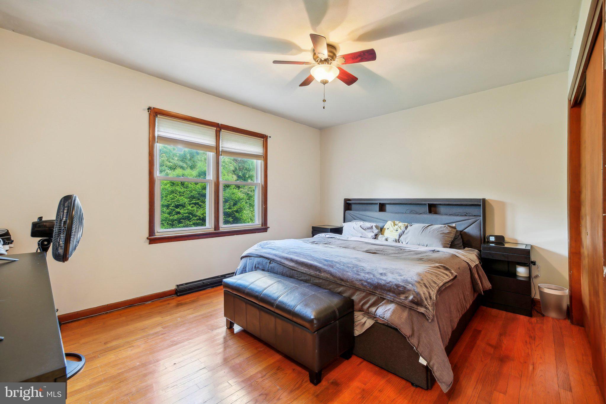 857 White Hall Road Littlestown, PA 17340 - Photo 27 of 32 a bed sitting in a bedroom next to a window