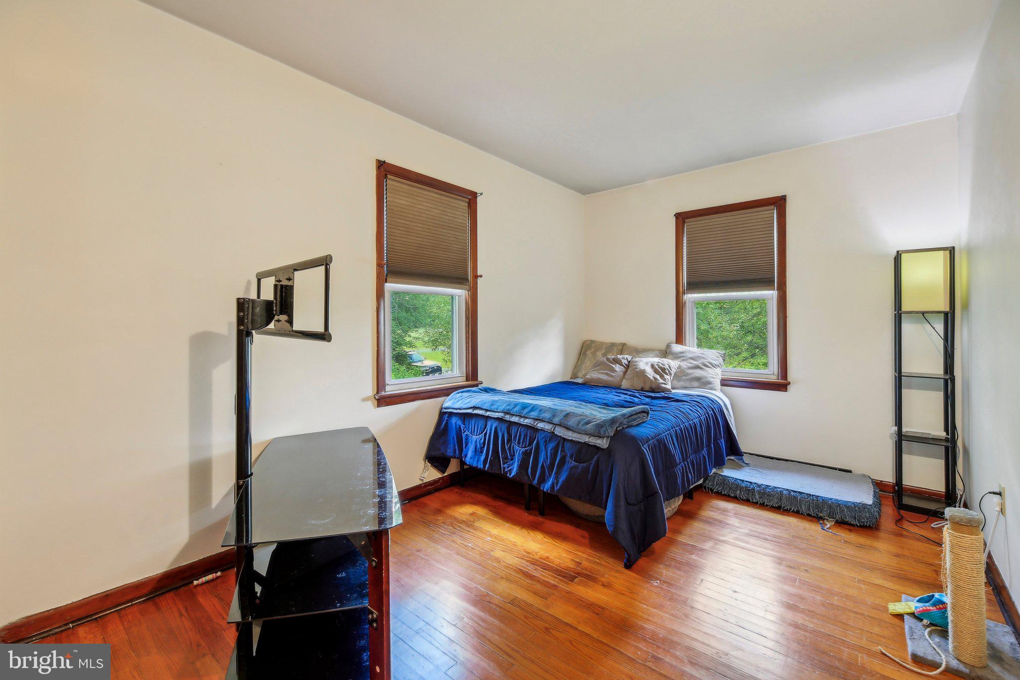 857 White Hall Road Littlestown, PA 17340 - Photo 3 of 32 a spacious bedroom with a bed window and a table
