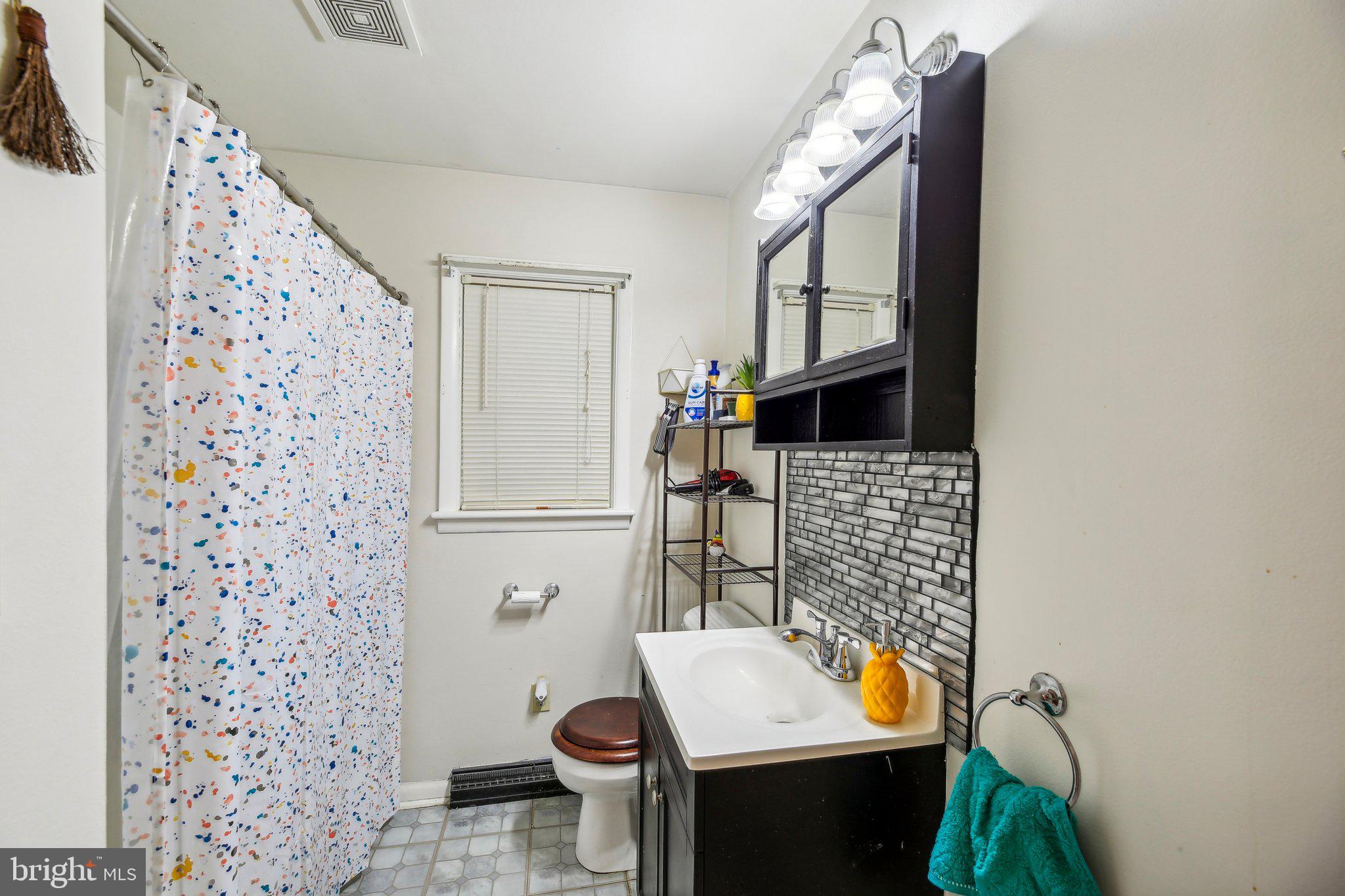 857 White Hall Road Littlestown, PA 17340 - Photo 5 of 32 a bathroom with a sink toilet and shower