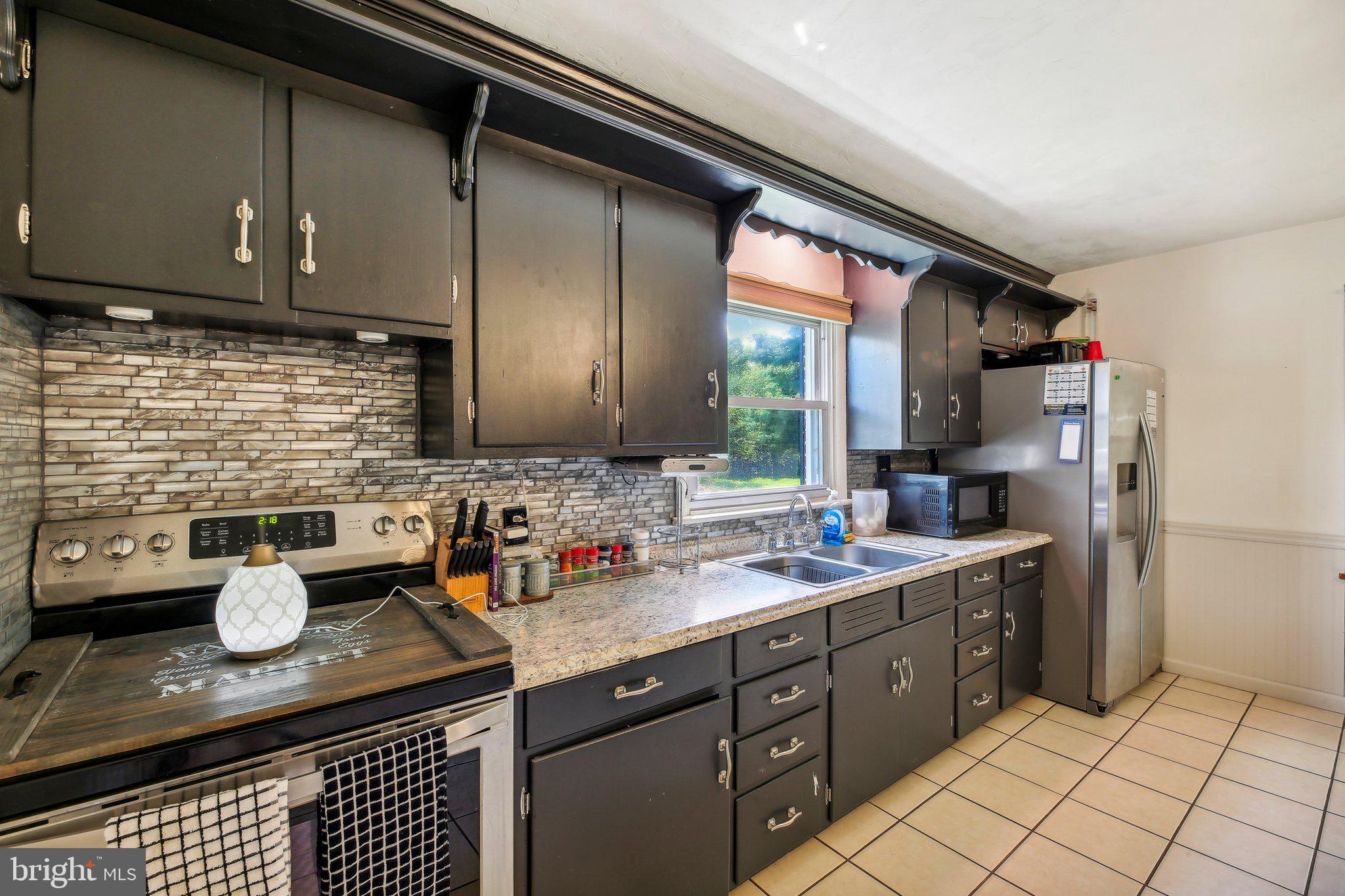 857 White Hall Road Littlestown, PA 17340 - Photo 6 of 32 a kitchen with a sink and cabinets