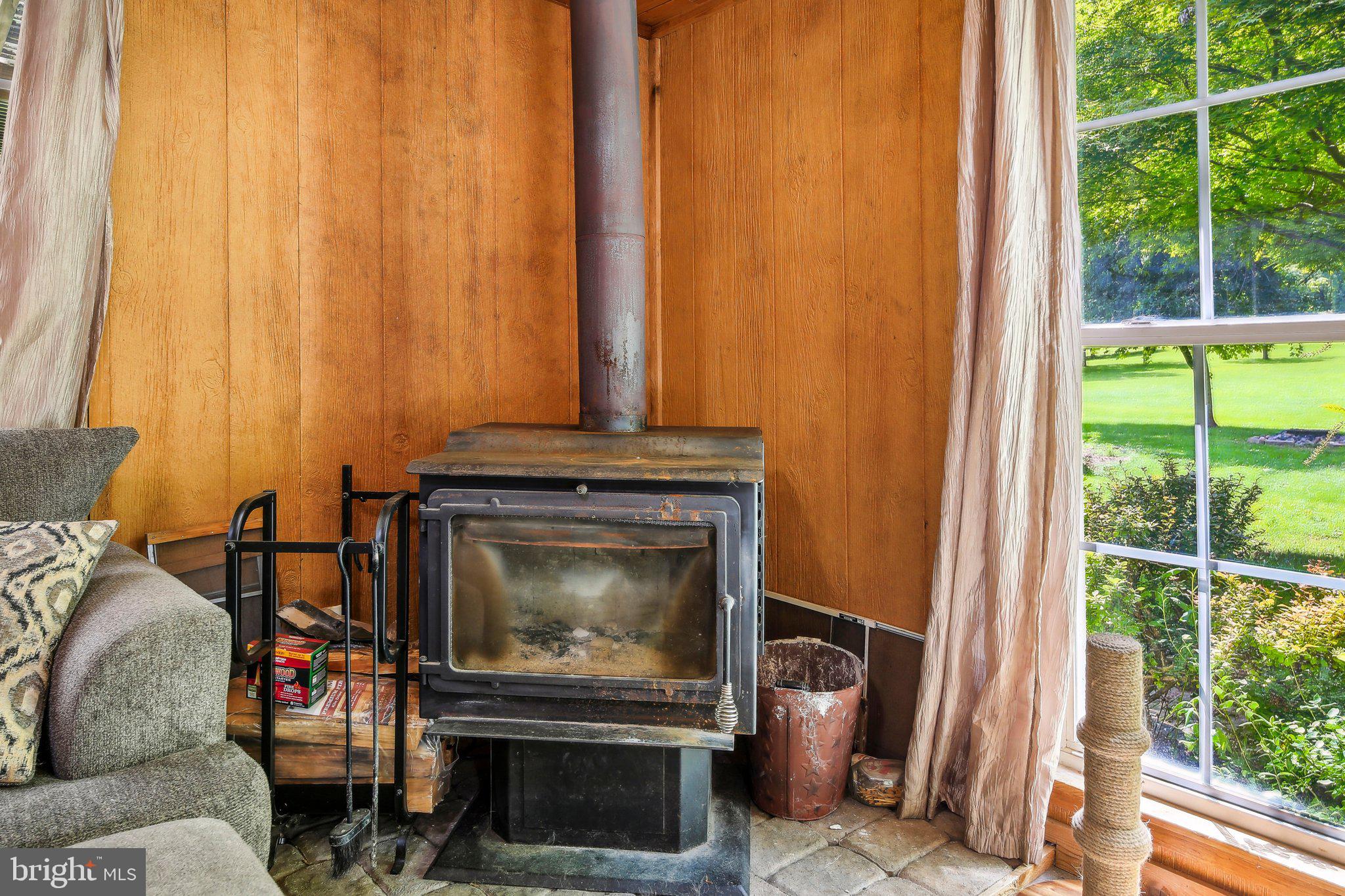 857 White Hall Road Littlestown, PA 17340 - Photo 10 of 32 a living room with a fireplace furniture and a large window