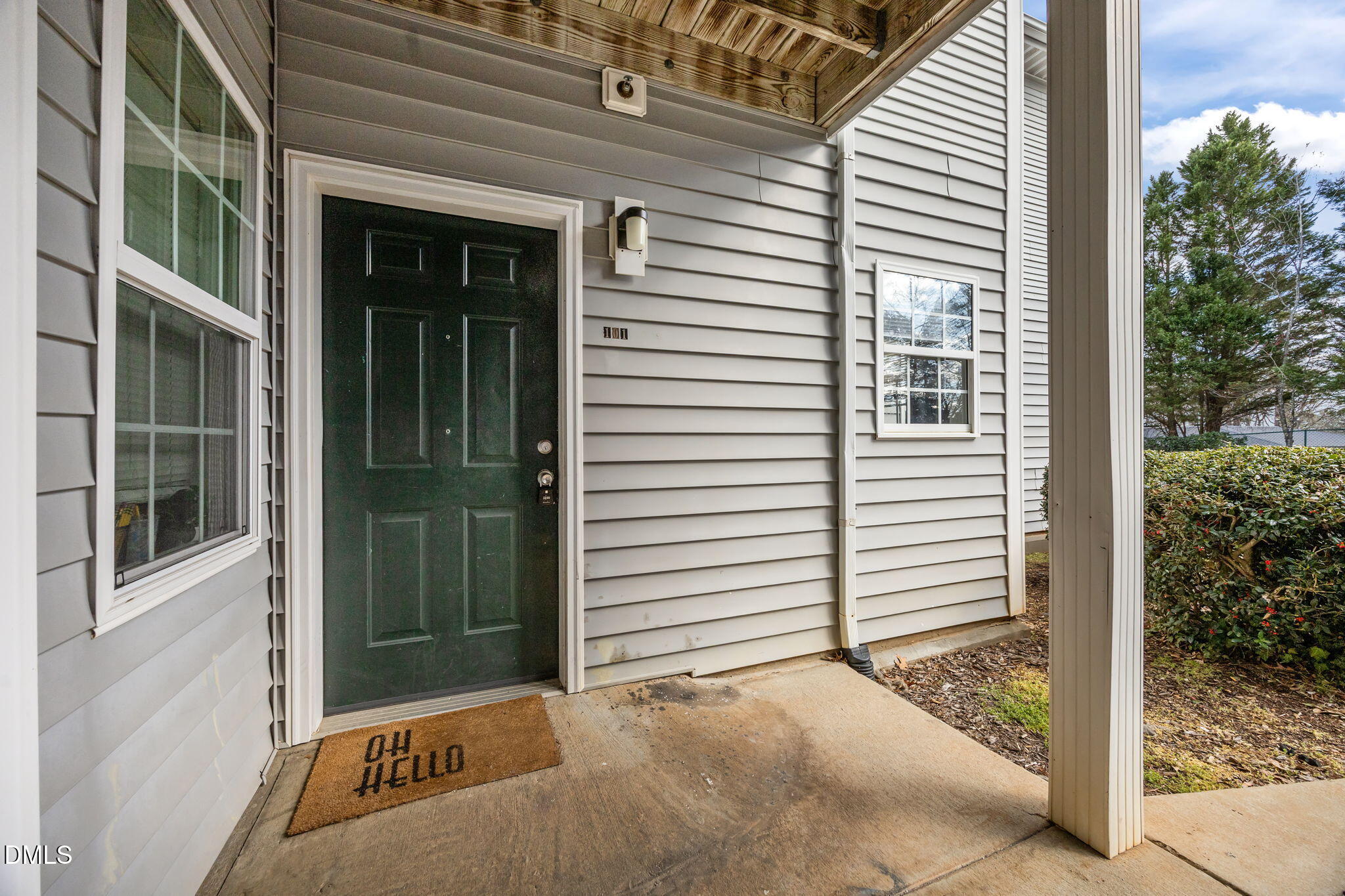 1305 Kent Road, Unit 101 Raleigh, NC 27606 - Photo 3 of 29 a view of a porch with a door and a large window