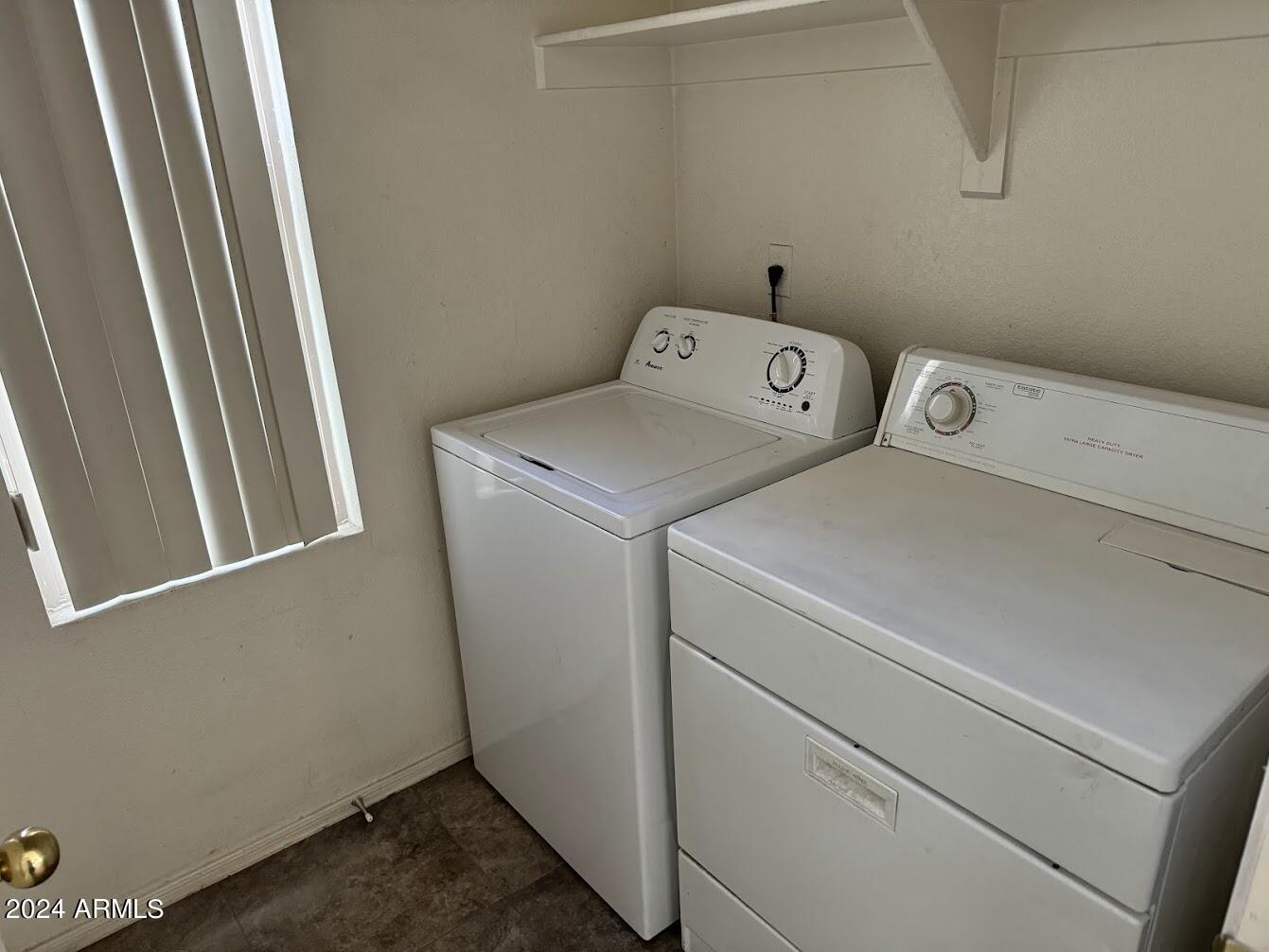 9401 West Berkeley Road Phoenix, AZ 85037 - Photo 13 of 27 a utility room with dryer and washer