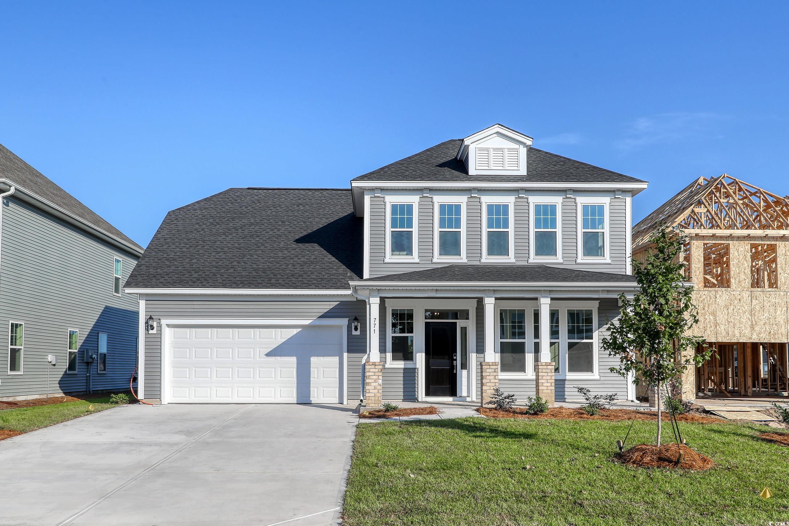 771 Enchantment Loop Myrtle Beach, SC 29588 - Photo 1 of 40 View of front facade featuring a garage, covered p
