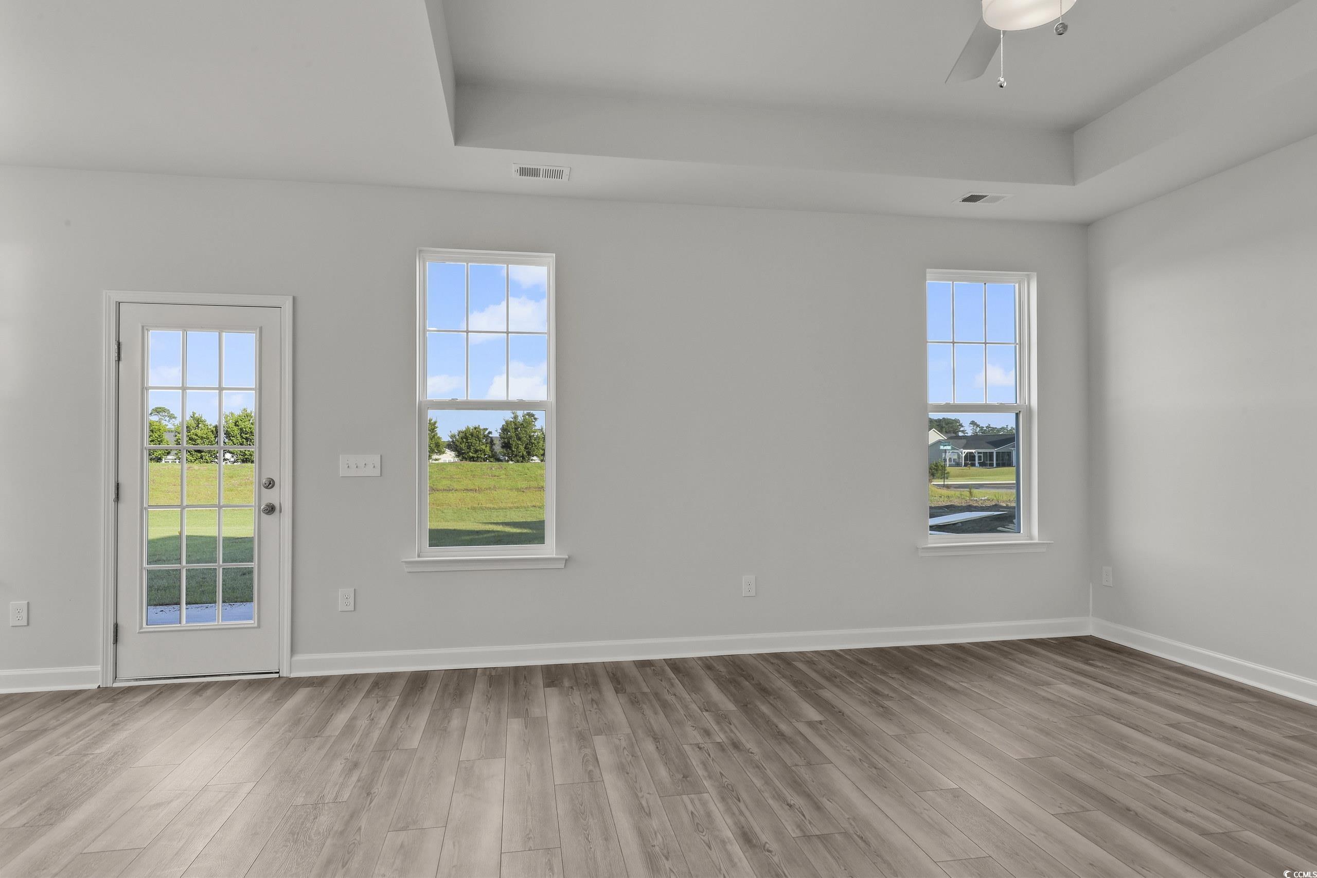 771 Enchantment Loop Myrtle Beach, SC 29588 - Photo 11 of 40 Empty room with light wood-type flooring, ceiling