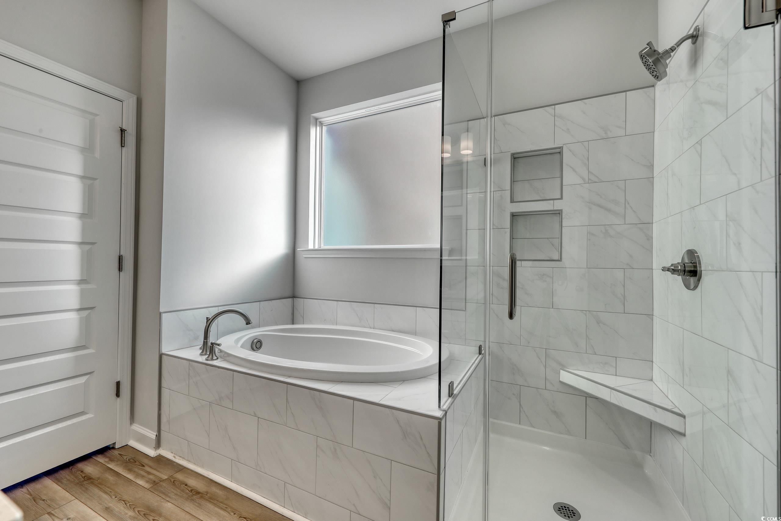 771 Enchantment Loop Myrtle Beach, SC 29588 - Photo 13 of 40 Bathroom with separate shower and tub and hardwood