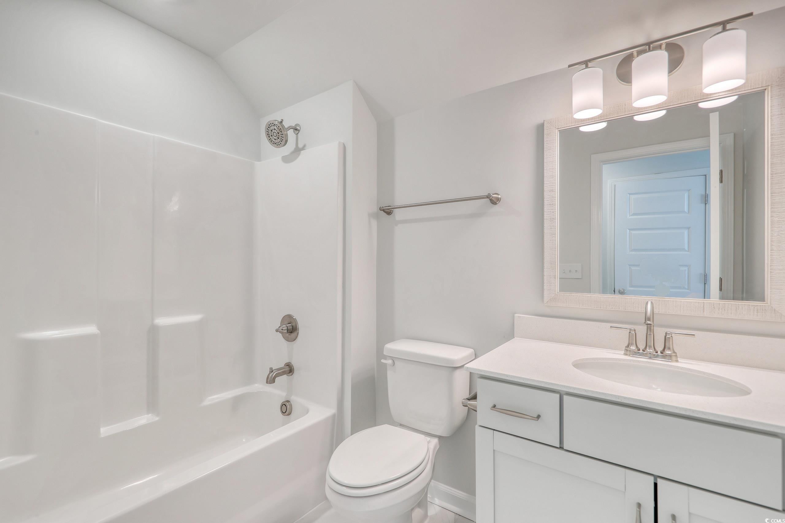 771 Enchantment Loop Myrtle Beach, SC 29588 - Photo 22 of 40 Full bathroom featuring lofted ceiling, toilet, sh