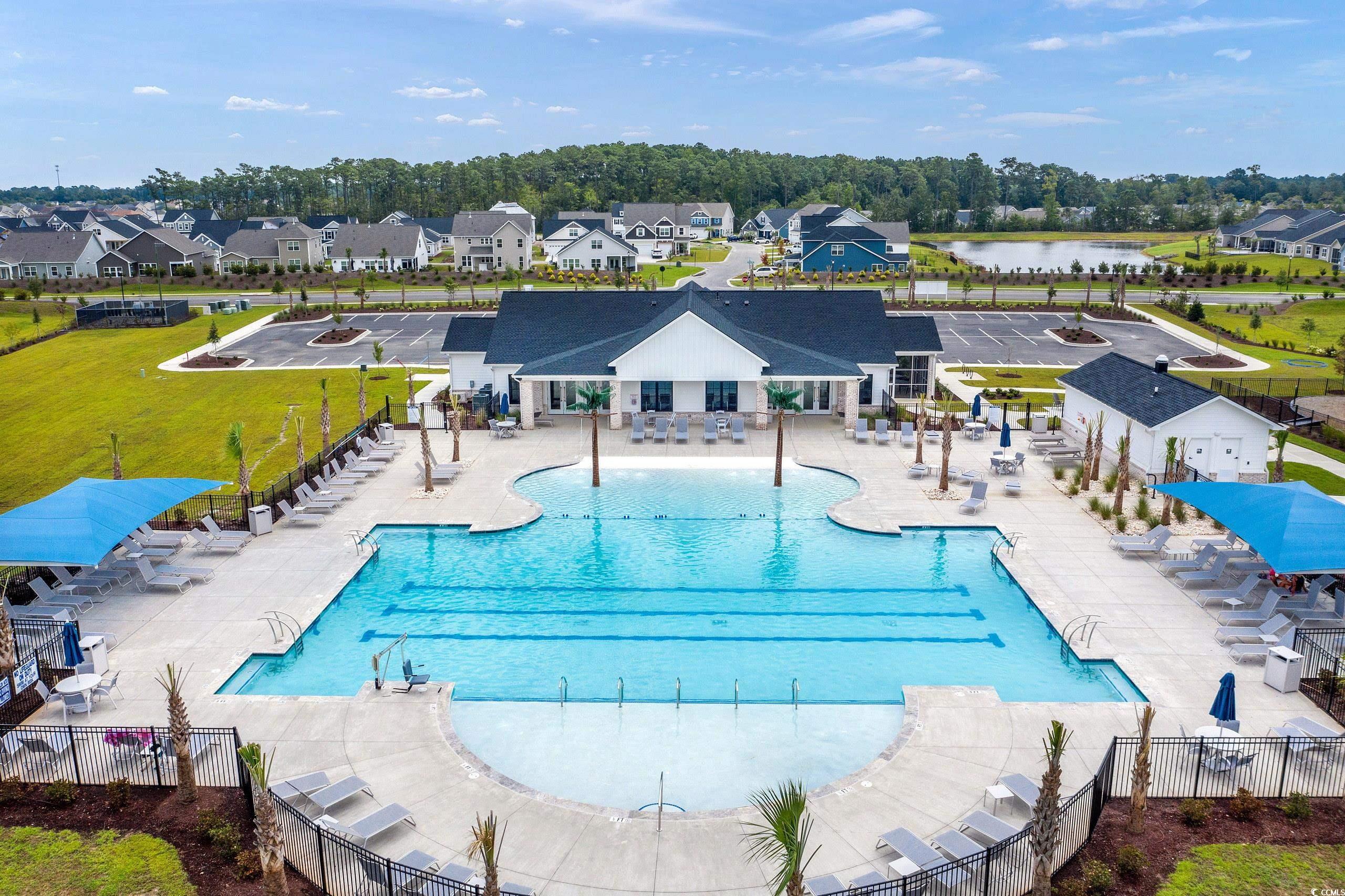 771 Enchantment Loop Myrtle Beach, SC 29588 - Photo 29 of 40 View of swimming pool with a water view, a yard, a