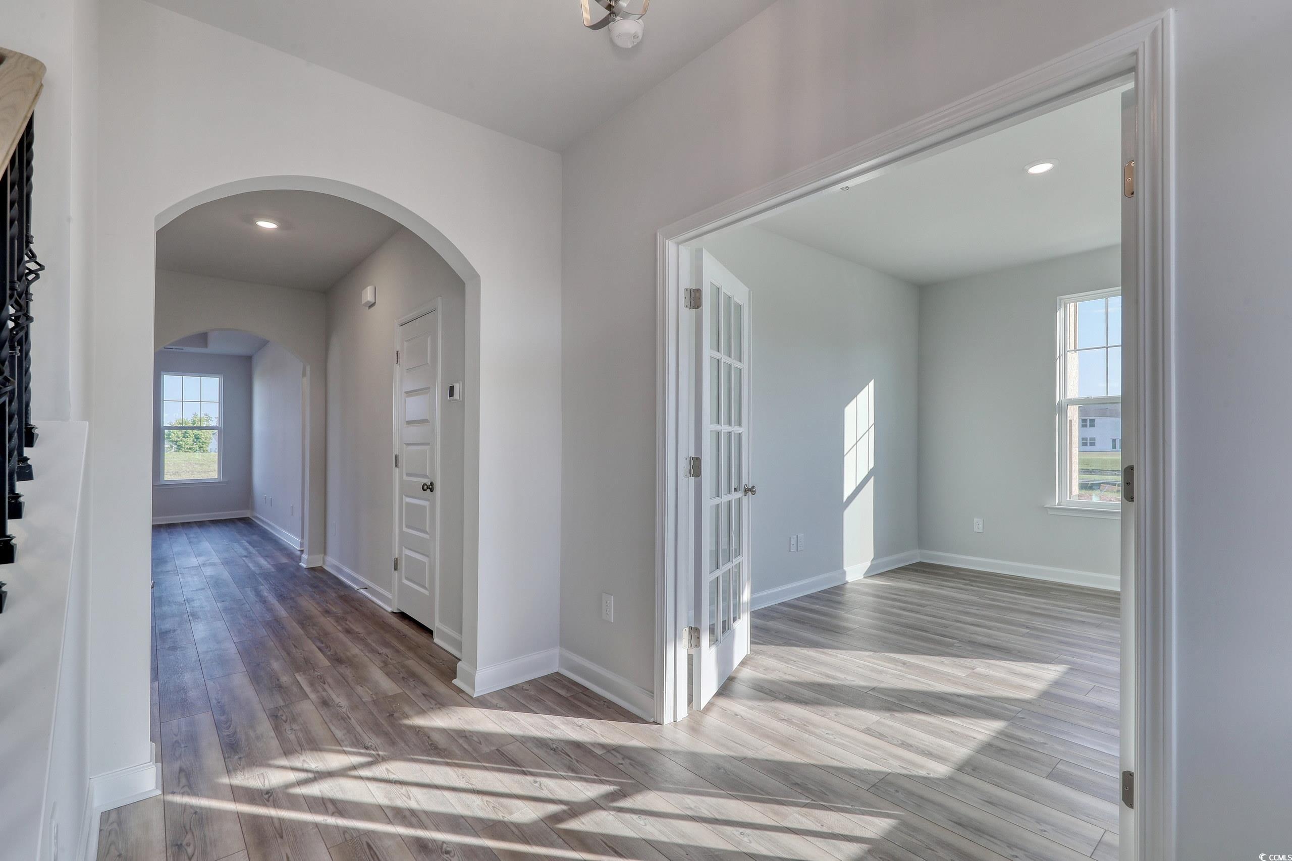 771 Enchantment Loop Myrtle Beach, SC 29588 - Photo 3 of 40 Hallway with light hardwood / wood-style flooring